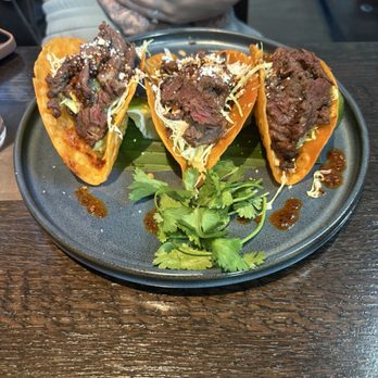 South of Nick's signature dishes Birria TacosAhi Ceviche TostadaGuacamole